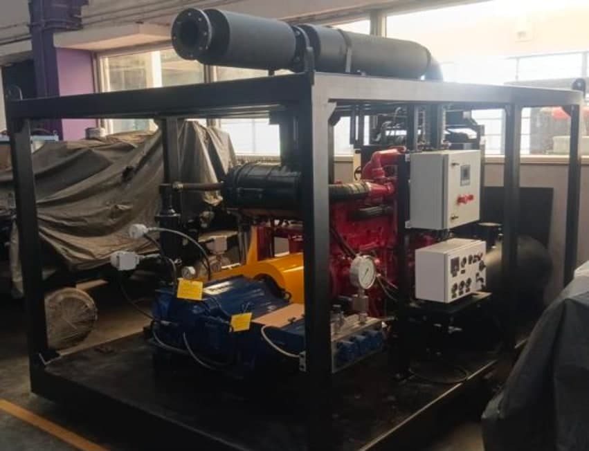 KDD diesel hydro blasting unit in its steel frame, with red Kirloskar engine, blue pump and control panels